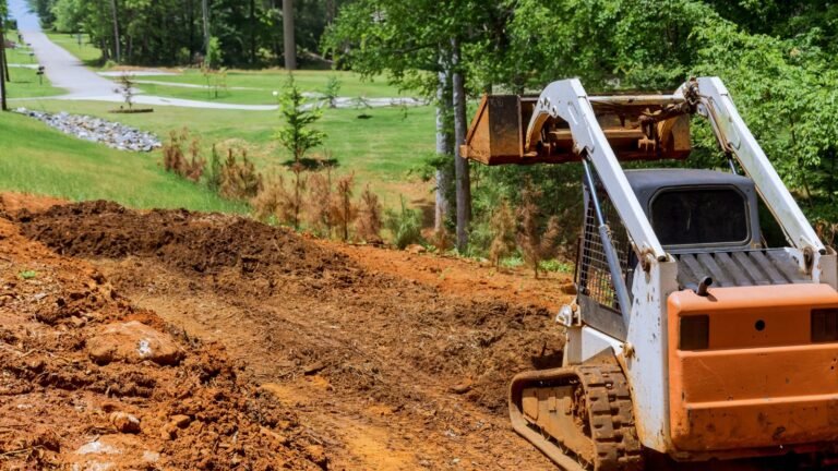 Skid steer moving dirt for excavation project in Jeffersonville IN